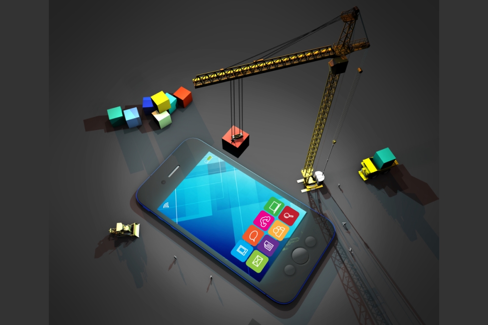 Grafika s mobilním telefonem, do kterého jeřáb přidává ikony nových aplikací.